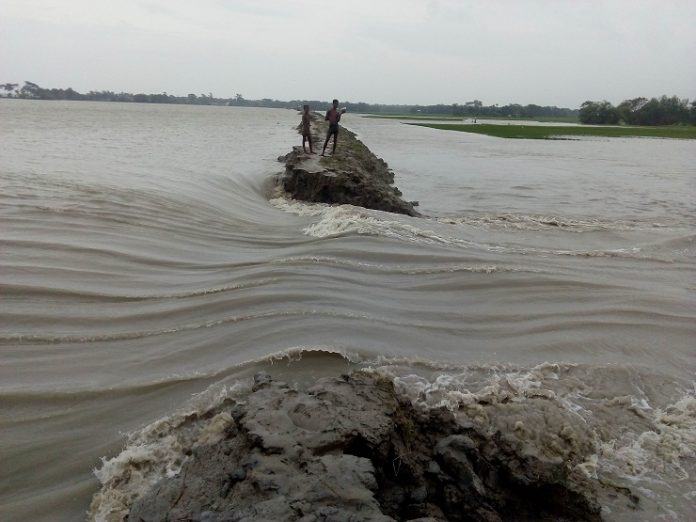 বাঁধ ভেঙে